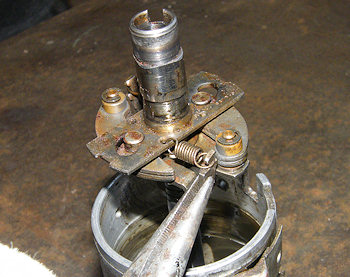 Bending the spring retaining posts on the centrifugal advance