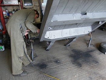 Renoving sand blasted into chassis sections