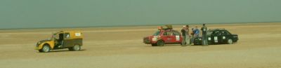 Citroen 2cv on a sandy plain