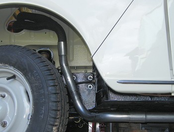 Front of exhaust bent to clear wheel
