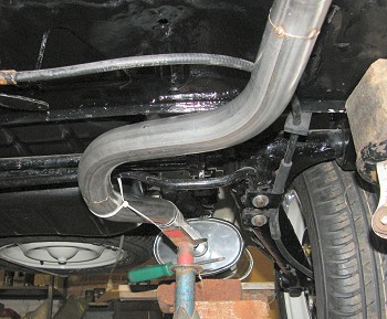 Rear of exhaust routed around anti-roll bar