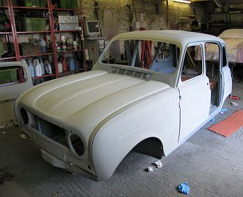 Fronkt and rear wings fitted.   Car in primer