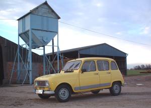 Ermintrude the Renault 4 from side with grain silo