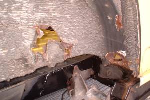Rear wheelarch rust at seatbelt mounting