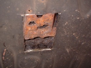 Rust hole inboard of chassis rail
