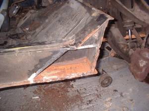 rusty metal removed from front corner of chassis